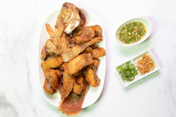 Deliciously fried Ruby fish served with spicy sauce.