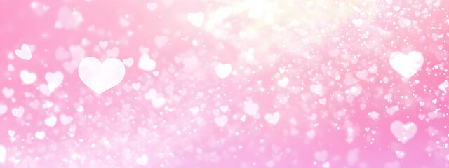 Abstract blurred pink background with white hearts for Valentine's Day, wedding, or other events