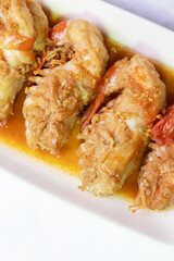Garlic shrimp stir-fry on white plate; easy and delicious menu.