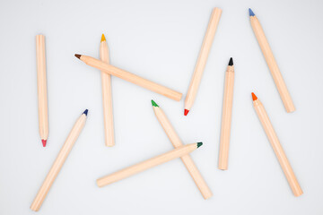 Assorted colored pencils on white background. Creative art supplies display