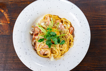 Delicious spaghetti dish with fresh herbs and cheese served elegantly