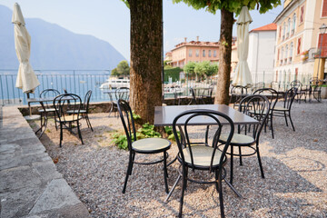 Empty Outdoor Cafe With Scenic Lake And Mountain View