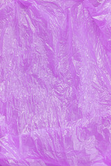 Crumpled purple plastic texture background.