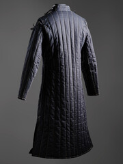 Historical fashion. Medieval knight cloth. Padded jacket gambeson.