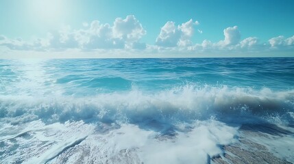 Fototapeta premium Serene sandy ocean beach with endless blue sea under warm golden glow