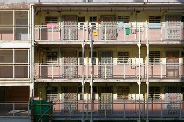 Crowded narrow flats of a building in an old public housing community in Kennedy Town, Hong Kong, a phenomenon of high housing density and severe housing shortage due to overpopulation in HongKong