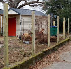 Positioning  posts in concrete for new fence