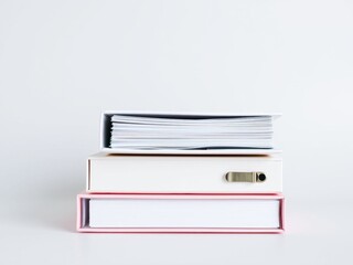 Stack of white and pink boxes with documents
