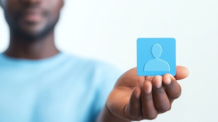 Man exploring digital space, interacting with a vibrant, floating blue square icon representing modern technology.