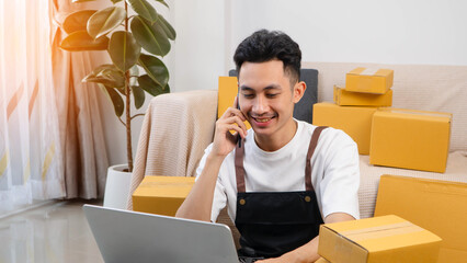 Small business owner packing boxes for online orders ready for shipping, Man taping cardboard boxes for shipping, Preparing to send packages, preparing/packing boxes of online orders