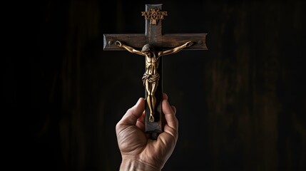 Hand Holding Dark Wooden Crucifix with Jesus Christ Figurine Religious Faith Symbol