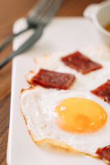 fried eggs with sausage for breakfast.