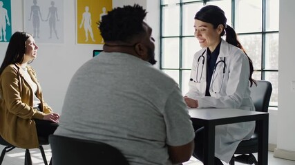 Compassionate nutritionist offering personalized weight management guidance during supportive healthcare consultation in medical clinic environment