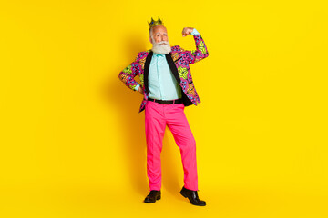 Full size photo of handsome pensioner mister king flexing show muscles dressed colorful pink classy garment isolated on yellow background