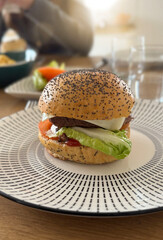 beef hamburger on a plate on a table