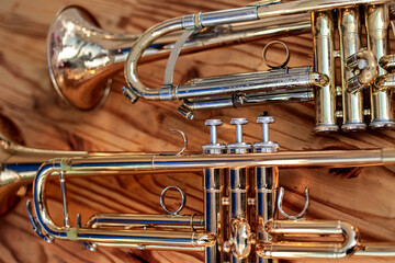 Copper musical instruments on a wooden background