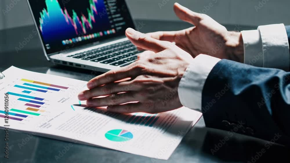 Aufkleber businessman in suit reviews charts and graphs on a document, gesturing with hands in slow motion, wh