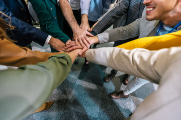 Stack of hands. Unity and teamwork in the office after an conference, seminar. Top view.