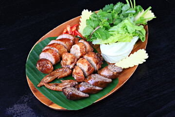 Northern Thai Sausage or Sai-Aua, filled with chopped lemongrass, galangal, kaffir lime, coriander and red curry paste 