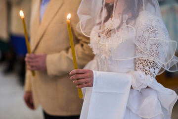 An Elegant Bride Holding a Candle During a Beautiful Wedding Ceremony Celebration Event
