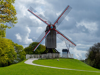 Obraz premium Belgium, Bruges, windmill on levee
