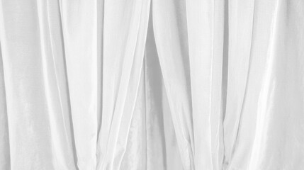 Obraz premium The white curtains are drawn open, revealing a plain white background