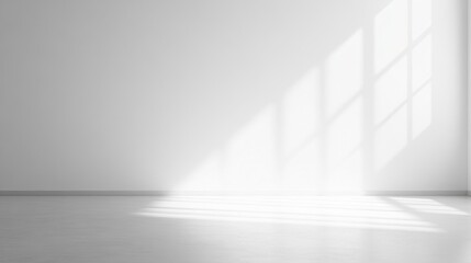 A white room with a window that is letting in sunlight