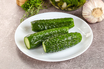 Homemade lighty salted cucumbers with herbs