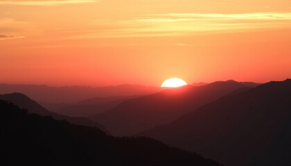 Obraz premium A breathtaking sunrise over mountain peaks, casting a golden glow on the landscape, symbolizing a peaceful morning.