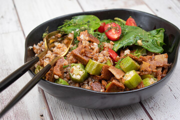 Seitan, buckwheat groats and avocado bowl as vegan lunch