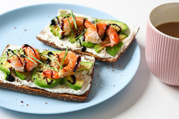 Delicious avocado shrimp toast with coffee, a healthy breakfast concept