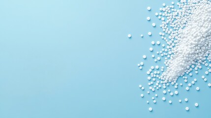 Granulated Sugar Spilling on a Soft Blue Surface with a Clean and Minimalist Aesthetic