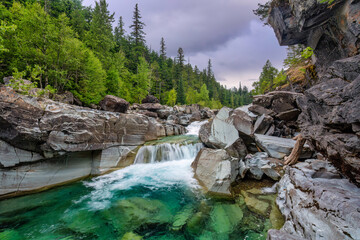 waterfall in the mountains on Lake McDonald Stream - on the Going-to-the-sun Road - Glacier National Park © Craig Zerbe