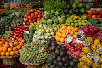 A market stall with colorful tropical fruits. 
Funchal indoor market