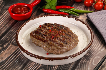 Grilled beef burger cutlet with sauce