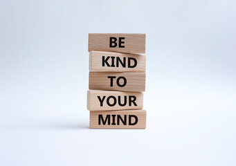 Be kind to your Mind symbol. Wooden blocks with words Be kind to your Mind. Beautiful white...