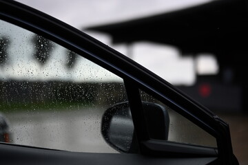 open car door on a rainy day