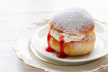 Homemade Semla or semlor, vastlakukkel, laskiaispulla - traditional Scandinavian sweet bun especially Fastelavn Shrove Monday and Shrove Tuesday.
