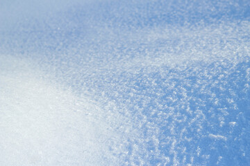 blue snow background in sunny winter day