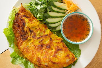 A top down view of a plate of banh xeo.