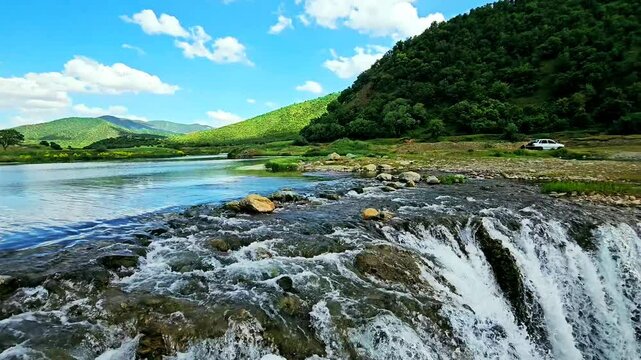 Natural waterfall in lush Marivan: cascading water over rocks into a serene pool.
📍Marivan - Kurdistan  