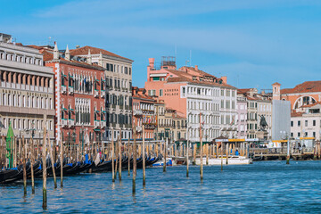The Grand Canal, with gondolas, boats, ancient buildings and palaces. It is the main navigation channel linking Basin São Marcos to the Santa Lucia railway station. Venice, Italy, 2019