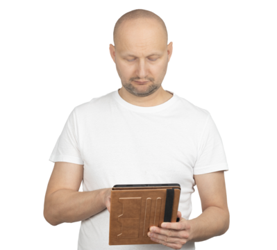 Middle-aged bald man in white t-shirt using a tablet with brown cover