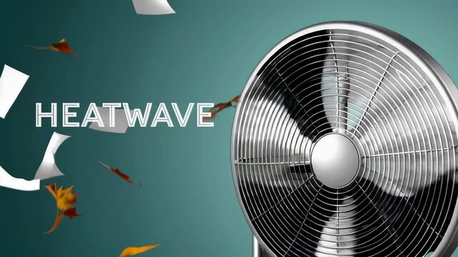 Autumn leaves and sheets of paper fly in the air current generated by a rotating metallic fan, illustrating a heatwave concept in slow motion