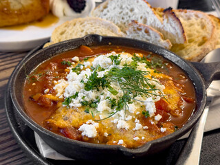 A closeup view of a shakshuka entree.