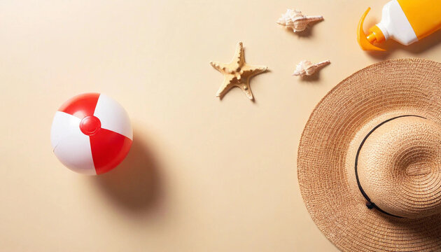 Aerial composition of a beach ball, sunscreen, straw hat, and seashells on a pastel-colored sandy texture.