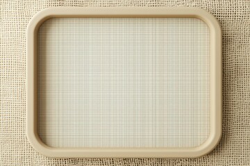 Beige borders on a minimalist 3D wireframe, resting symmetrically on a textured gradient.