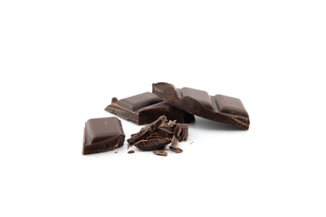 Levitating milk chocolate chunks isolated on white background. Crumbs, shavings and Flying Chocolate pieces Top view. Flat lay