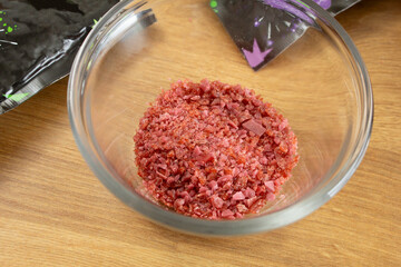 A view of a small glass bowl of popping candy.