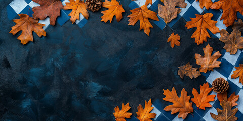 Autumn leaves and pine cones on dark background